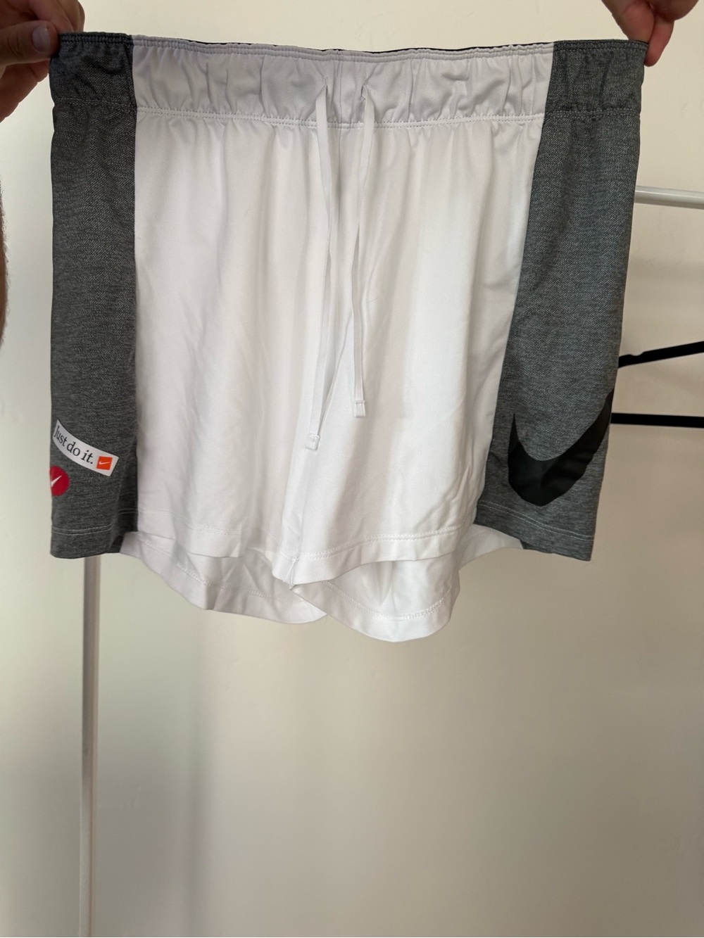 Nike Gray Shorts with Red Swoosh and 'Just Do It' Tag